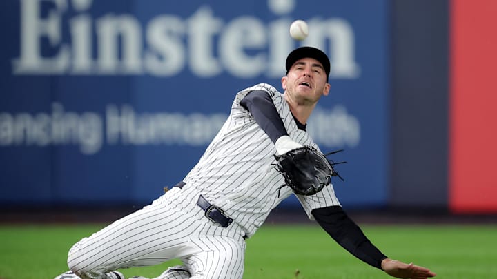 Oct 8, 2025; Bronx, New York, USA; New York Yankees left fielder Cody Bellinger (35) makes a sliding catch on a pop up by Toronto Blue Jays center fielder Daulton Varsho (not pictured) during the first inning of game four of the ALDS round of the 2025 MLB playoffs at Yankee Stadium. Mandatory Credit: Brad Penner-Imagn Images