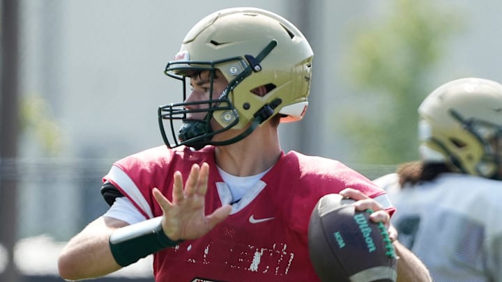 Racine Case High School senior quarterback Brayden Lipari runs through drills during practice at Hammes Field on Friday August 8, 2025.