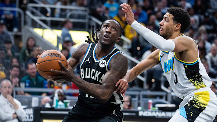 Dec 31, 2024; Indianapolis, Indiana, USA; Milwaukee Bucks forward Taurean Prince (12) shoots the ball while Indiana Pacers guard Tyrese Haliburton (0) defends in the second half at Gainbridge Fieldhouse. Mandatory Credit: Trevor Ruszkowski-Imagn Images Dec 31, 2024; Indianapolis, Indiana, USA; Milwaukee Bucks forward Taurean Prince (12) shoots the ball while Indiana Pacers guard Tyrese Haliburton (0) defends in the second half at Gainbridge Fieldhouse. Mandatory Credit: Trevor Ruszkowski-Imagn Images