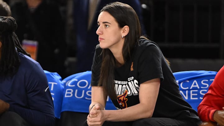 Sep 7, 2025; Baltimore, MD, USA; Indiana Fever guard Caitlin Clark (22) looks on from the bench against the Washington Mystics during the first quarter at CFG Bank Arena. Mandatory Credit: Rafael Suanes-Imagn Images