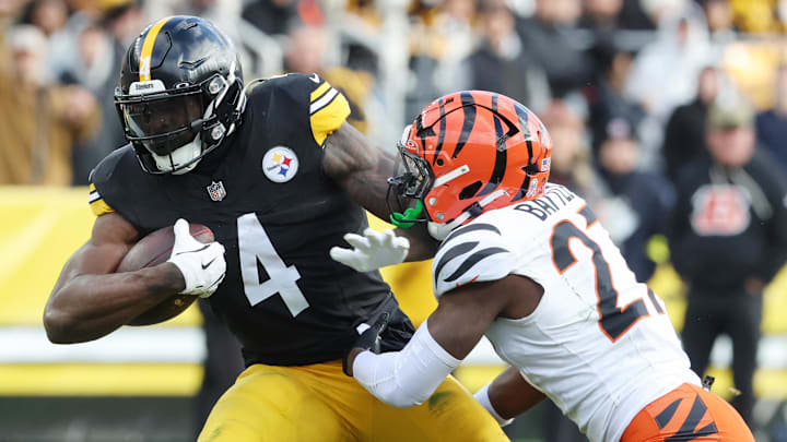 Nov 16, 2025; Pittsburgh, Pennsylvania, USA; Pittsburgh Steelers wide receiver DK Metcalf (4) runs with the ball against Cincinnati Bengals safety Jordan Battle (27) during the second half at Acrisure Stadium. Nov 16, 2025; Pittsburgh, Pennsylvania, USA; Pittsburgh Steelers wide receiver DK Metcalf (4) runs with the ball against Cincinnati Bengals safety Jordan Battle (27) during the second half at Acrisure Stadium.