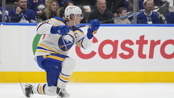Jan 27, 2026; Toronto, Ontario, CAN; Buffalo Sabres defenseman Rasmus Dahlin (26) scores with this shot on an empty net against the Toronto Maple Leafs during the third period at Scotiabank Arena. Mandatory Credit: John E. Sokolowski-Imagn Images