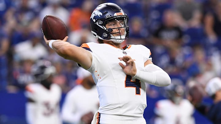 INDIANAPOLIS, IN - AUGUST 11: Denver Broncos Quarterback Zach Wilson (4) warms up for the NFL, American Football Herren, USA Preseason game between the Denver Broncos and the Indianapolis Colts on August 11, 2024, at Lucas Oil Stadium in Indianapolis, Indiana. 