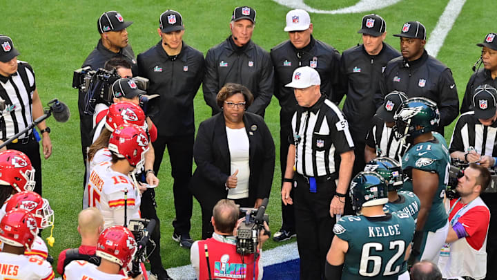 Feb 12, 2023; Glendale, Arizona, US; 2021 Tillman scholar Fabersha Flynt tosses the coin before