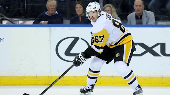 Oct 7, 2025; New York, New York, USA; Pittsburgh Penguins center Sidney Crosby (87) skates with the puck against the New York Rangers during the second period at Madison Square Garden. Mandatory Credit: Brad Penner-Imagn Images