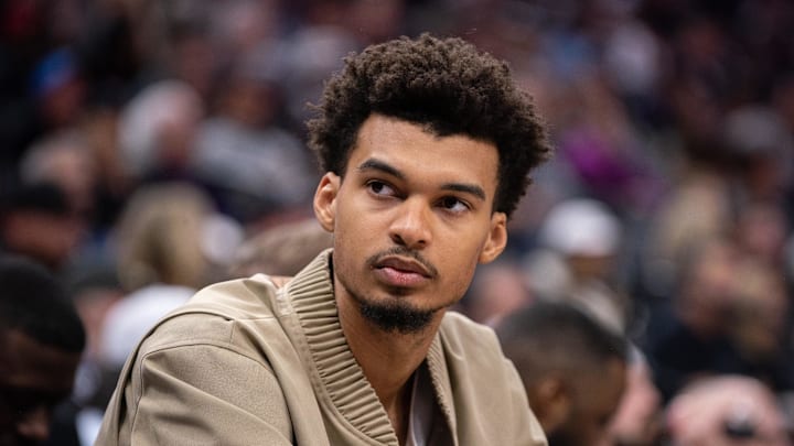 Mar 7, 2025; Sacramento, California, USA; San Antonio Spurs center Victor Wembanyama (1) looks on from the bench during the fourth quarter of the game against the Sacramento Kings at Golden 1 Center. Mandatory Credit: Ed Szczepanski-Imagn Images