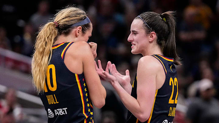 Caitlin Clark and Lexie Hull talk during a timeout for the Indiana Fever.