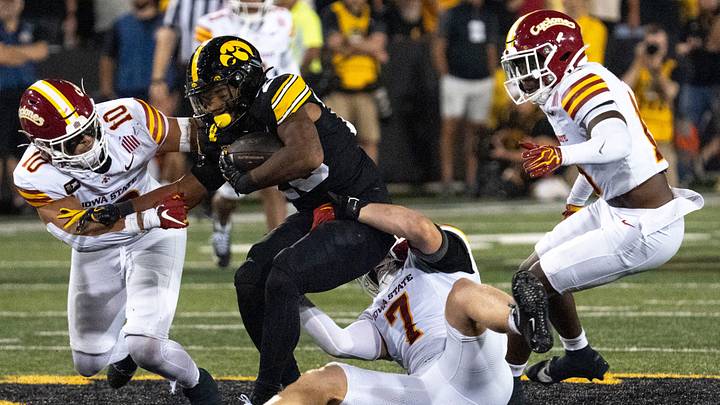 Iowa Hawkeyes running back Kamari Moulton (28) is tackled by Iowa State linebacker Sullivan Schlimgen (7) during the Cy-Hawk football game Sept. 12, 2026 at Kinnick Stadium in Iowa City, Iowa.