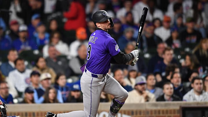 May 27, 2025; Chicago, Illinois, USA; Colorado Rockies center fielder Brenton Doyle (9) hits a sacrifice RBI ground out during the eleventh inning against the Chicago Cubs at Wrigley Field. Mandatory Credit: Patrick Gorski-Imagn Images