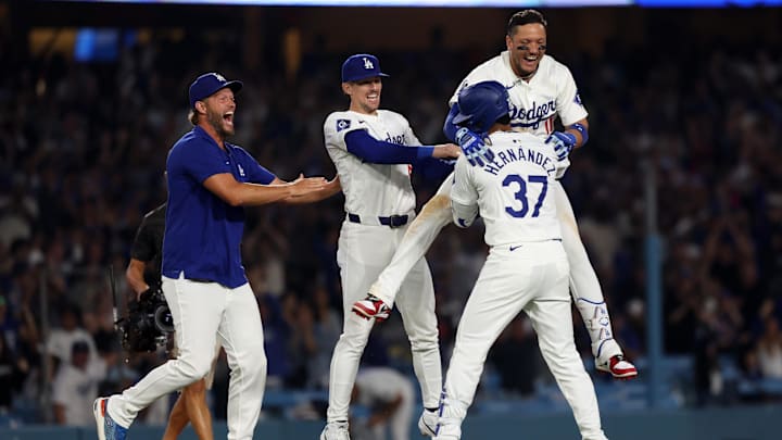 Jul 2, 2024; Los Angeles, California, USA; Los Angeles Dodgers left fielder Teoscar Hernandez (37) celebrates with pitcher Clayton Kershaw (L) and second baseman Cavan Biggio (C) and shortstop Miguel Rojas (11) after hitting a walk off hit to defeat the Arizona Diamondbacks in bottom of the ninth inning at Dodger Stadium. Mandatory Credit: Kiyoshi Mio-Imagn Images Jul 2, 2024; Los Angeles, California, USA; Los Angeles Dodgers left fielder Teoscar Hernandez (37) celebrates with pitcher Clayton Kershaw (L) and second baseman Cavan Biggio (C) and shortstop Miguel Rojas (11) after hitting a walk off hit to defeat the Arizona Diamondbacks in bottom of the ninth inning at Dodger Stadium. Mandatory Credit: Kiyoshi Mio-Imagn Images