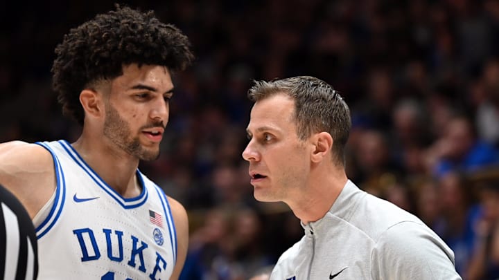 Jan 10, 2026; Durham, North Carolina, USA; Duke Blue Devils forward Cameron Boozer (12) talks to head coach Jon Scheyer during the first half against the SMU Mustangs.