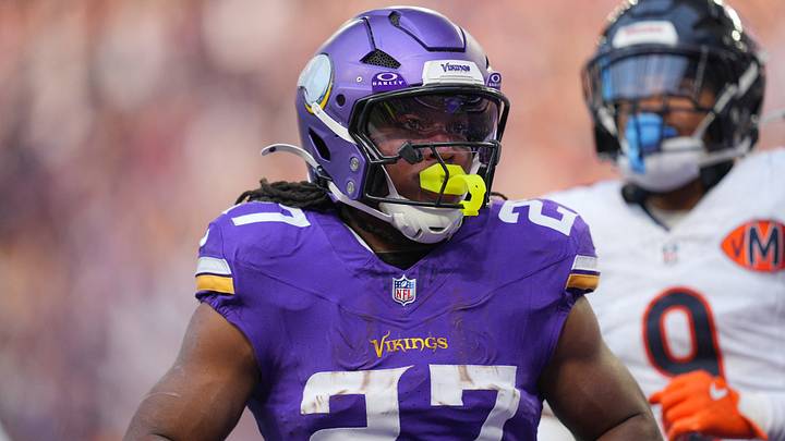 Nov 16, 2025; Minneapolis, Minnesota, USA; Minnesota Vikings running back Jordan Mason (27) runs in for a touchdown during the fourth quarter against the Chicago Bears at U.S. Bank Stadium. Mandatory Credit: Brad Rempel-Imagn Images