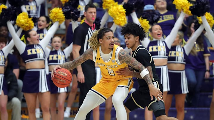Kent State Golden Flashes guard Marquis Barnett (2) looks to get around Akron Zips guard Sharron Young (3) during the first half of an NCAA college basketball game on Friday, Jan. 31, 2025, in Kent, Ohio.