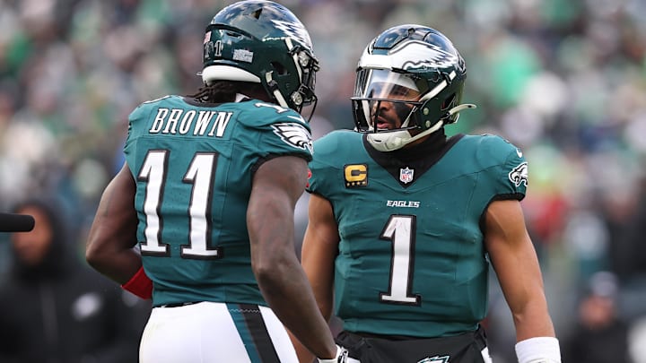 Dec 14, 2025; Philadelphia, Pennsylvania, USA; Philadelphia Eagles quarterback Jalen Hurts (1) reacts with wide receiver A.J. Brown (11) after their touchdown connection during the fourth quarter against the Las Vegas Raiders at Lincoln Financial Field.