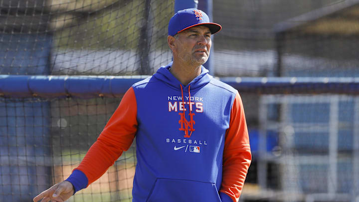 Mar 13, 2022; Port St. Lucie, FL, USA; New York Mets hitting coach Eric Chavez looks on as players take batting practice during spring training. Mandatory Credit: Sam Navarro-Imagn Images
