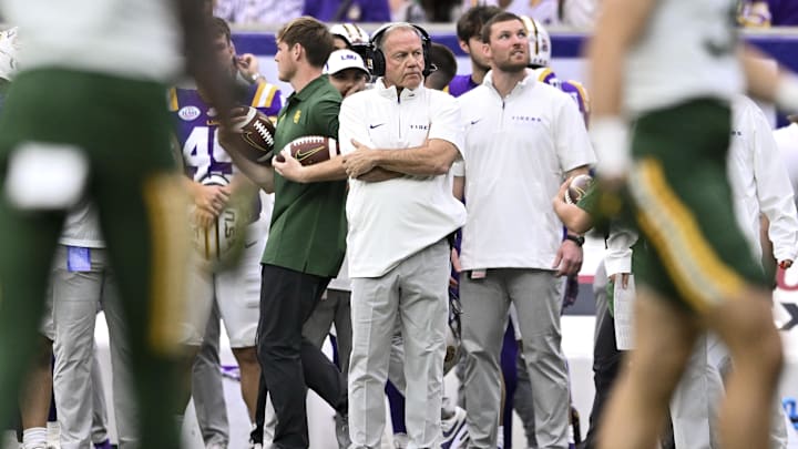 Dec 31, 2024; Houston, TX, USA; LSU Tigers head coach Brian Kelly looks on during the first quarter against the Baylor Bears at NRG Stadium. Mandatory Credit: Maria Lysaker-Imagn Images Dec 31, 2024; Houston, TX, USA; LSU Tigers head coach Brian Kelly looks on during the first quarter against the Baylor Bears at NRG Stadium. Mandatory Credit: Maria Lysaker-Imagn Images