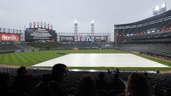 Tarp covers Rate Field in Chicago during a rain delay. Tarp covers Rate Field in Chicago during a rain delay.