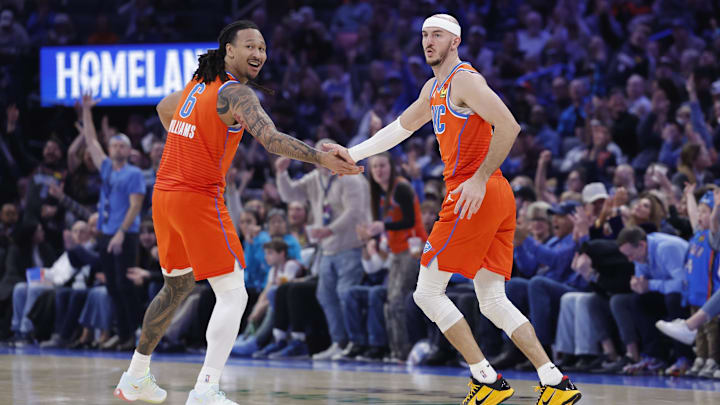 Jan 11, 2026; Oklahoma City, Oklahoma, USA; Oklahoma City Thunder forward Jaylin Williams (6) and guard Alex Caruso (9) celebrate after scoring against the Miami Heat during the second half at Paycom Center. Mandatory Credit: Alonzo Adams-Imagn Images