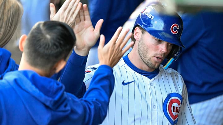 Oct 8, 2025; Chicago, Illinois, USA; Chicago Cubs second baseman Nico Hoerner (2) celebrates with teammates after scoring a run against the Milwaukee Brewers in the first inning during game three of the NLDS round for the 2025 MLB playoffs at Wrigley Field. Mandatory Credit: Matt Marton-Imagn Images Oct 8, 2025; Chicago, Illinois, USA; Chicago Cubs second baseman Nico Hoerner (2) celebrates with teammates after scoring a run against the Milwaukee Brewers in the first inning during game three of the NLDS round for the 2025 MLB playoffs at Wrigley Field. Mandatory Credit: Matt Marton-Imagn Images