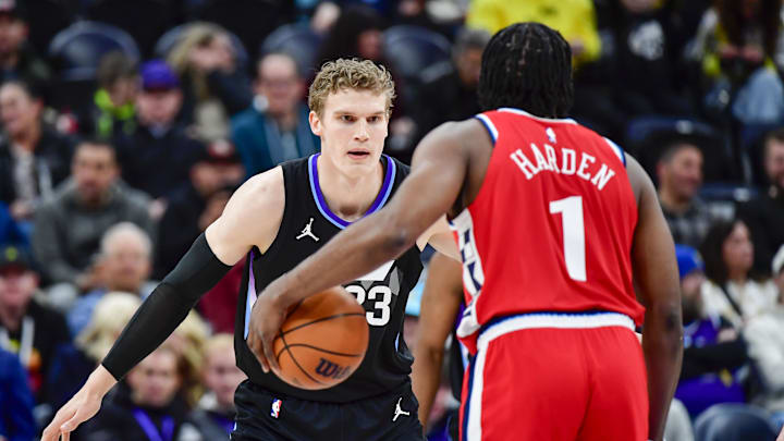 Feb 13, 2025; Salt Lake City, Utah, USA; Utah Jazz forward/center Lauri Markkanen (23) defends LA Clippers guard James Harden (1) during the first half at the Delta Center. Mandatory Credit: Christopher Creveling-Imagn Images
