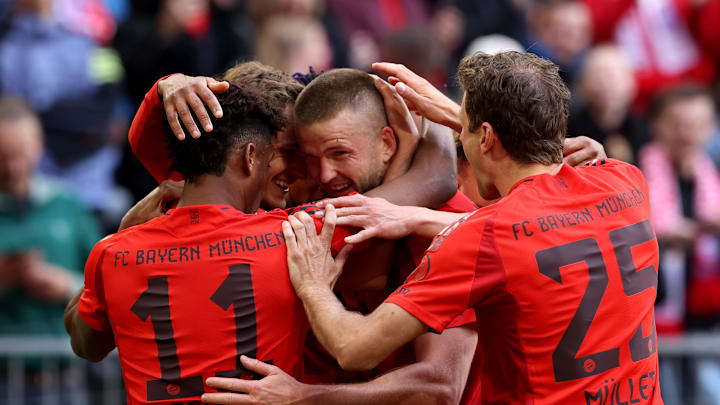Bayern Munich players celebrating after scoring a goal against Mainz.