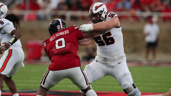 Sep 13, 2025; Lubbock, Texas, USA;  Texas Tech Red Raiders defensive tackle Skyler Gil-Howard (0) rushes against Oregon State Beavers offensive lineman Dylan Sikorski (56) in the second half at Jones AT&T Stadium. Mandatory Credit: Michael C. Johnson-Imagn Images