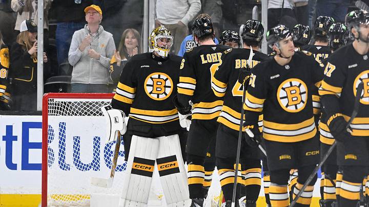 Oct 8, 2026; Boston, Massachusetts, USA; Boston Bruins goaltender Jeremy Swayman (1) celebrates victory over the Utah Mammoth with defenseman Mason Lohrei (6) during the third period at TD Garden. Mandatory Credit: Eric Canha-Imagn Images
