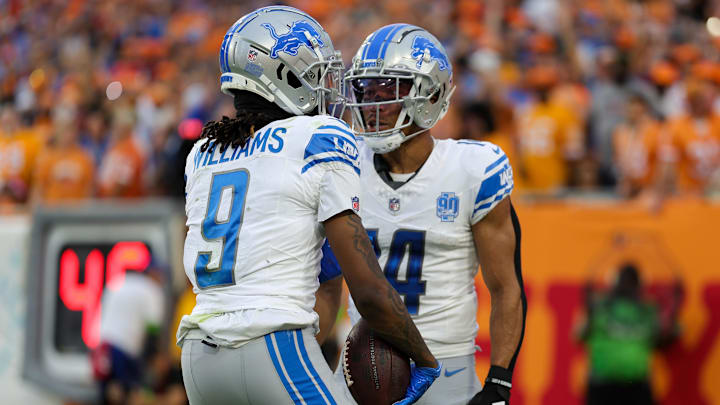Oct 15, 2023; Tampa, Florida, USA;  Detroit Lions wide receiver Jameson Williams (9) is congratulate by wide receiver Amon-Ra St. Brown (14) after scoring a touchdown against the Tampa Bay Buccaneers in the third quarter in the third quarter at Raymond James Stadium. Mandatory Credit: Nathan Ray Seebeck-Imagn Images
