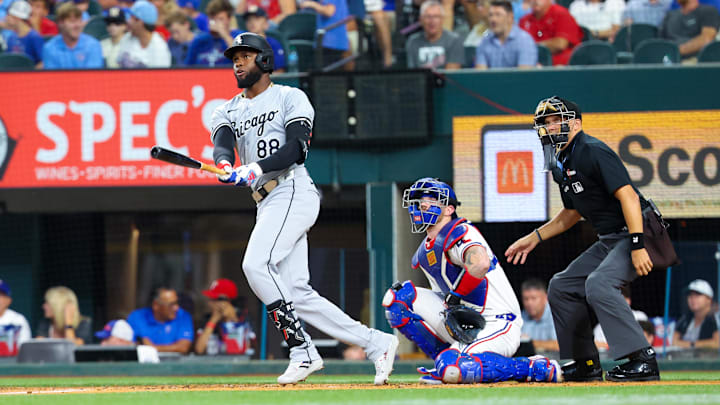 Jul 24, 2024; Arlington, Texas, USA; Chicago White Sox center fielder Luis Robert Jr. (88) hits a home run during the third inning against the Texas Rangers at Globe Life Field.
