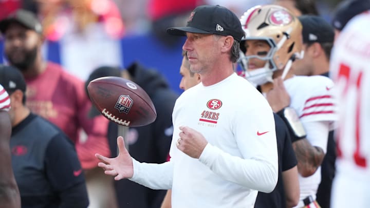 Nov 2, 2025; East Rutherford, New Jersey, USA; San Francisco 49ers head coach Kyle Shanahan tosses a football in the air during warm ups prior to a game against the New York Giants at MetLife Stadium. Mandatory Credit: Robert Deutsch-Imagn Images