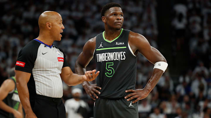 NBA referee Marc Davis talks to Minnesota Timberwolves guard Anthony Edwards during the second quarter in Game 5 of the Western Conference finals against the Dallas Mavericks at Target Center in Minneapolis on May 30, 2024.
