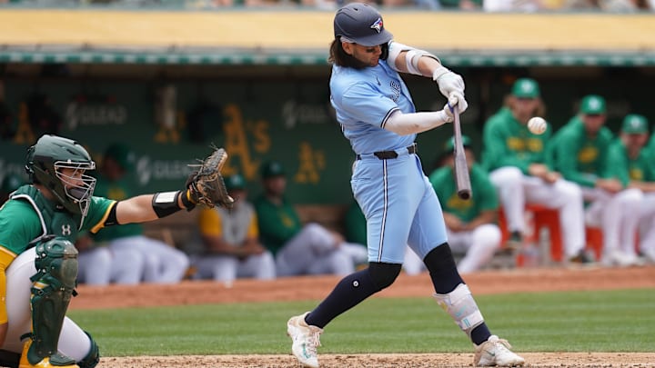 Jun 8, 2024; Oakland, California, USA; Toronto Blue Jays shortstop Bo Bichette (11) hits an RBI double against the Oakland Athletics in the fifth