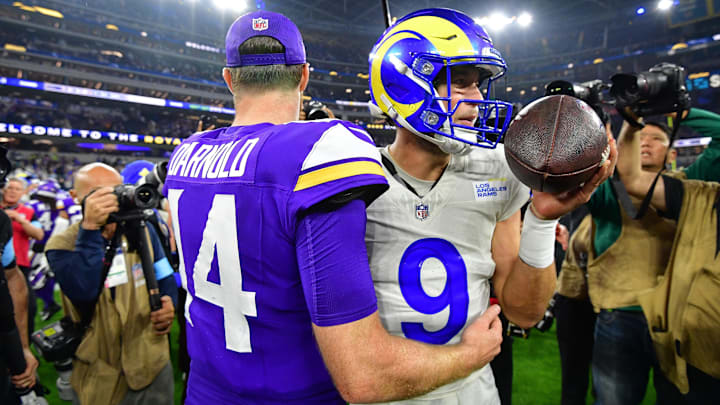Oct 24, 2024; Inglewood, California, USA; Minnesota Vikings quarterback Sam Darnold (14) meets with Los Angeles Rams quarterback Matthew Stafford (9) following the game at SoFi Stadium.