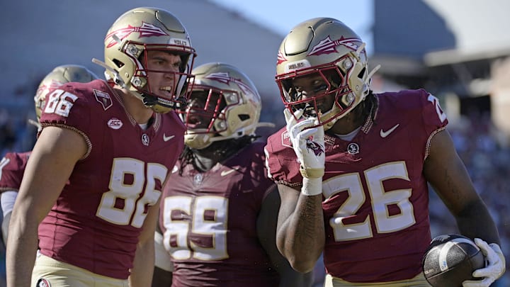 Nov 23, 2024; Tallahassee, Florida, USA; Florida State Seminoles running back Caziah Holmes (26) celebrates a touchdown run during the second half against the Charleston Southern Buccaneers at Doak S. Campbell Stadium. Mandatory Credit: Melina Myers-Imagn Images