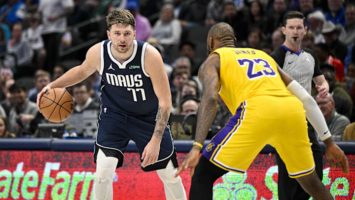 Dec 12, 2023; Dallas, Texas, USA; Dallas Mavericks guard Luka Doncic (77) and Los Angeles Lakers forward LeBron James (23) in action during the game between the Dallas Mavericks and the Los Angeles Lakers at the American Airlines Center. Mandatory Credit: Jerome Miron-Imagn Images