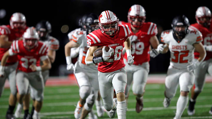Kimberly High School's Kegan Pleau (26) runs for a long gain in the second quarter against Kaukauna High School during their football game Friday, October 11, 2024, in Kimberly, Wisconsin. Kimberly won 38-20.