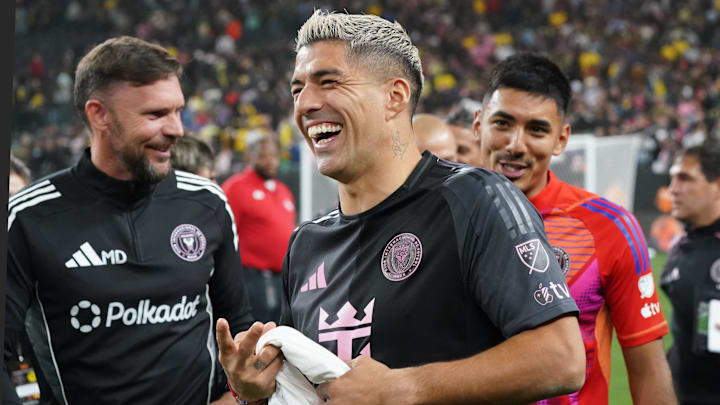 Inter Miami CF forward Luis Suarez (9) walks off the field smiling after a penalty kicks win against Club America at Allegiant Stadium.