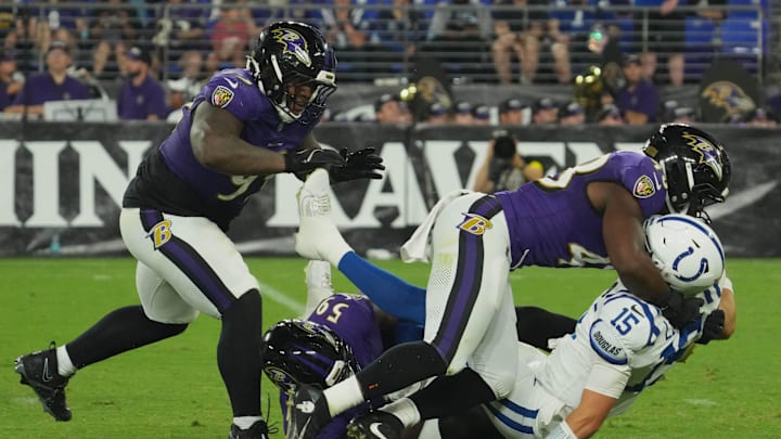 Aug 7, 2025; Baltimore, Maryland, USA; Indianapolis Colts quarterback Riley Leonard (15) under pressure by Baltimore Ravens linebacker Chandler Martin (48) during the second quarter at M&T Bank Stadium. Mandatory Credit: Mitch Stringer-Imagn Images