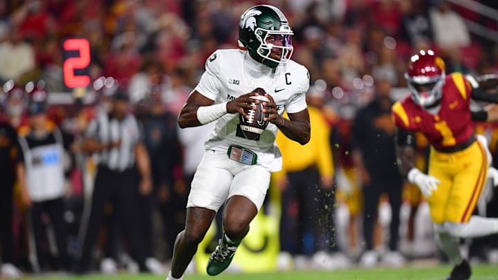 Sep 20, 2025; Los Angeles, California, USA; Michigan State Spartans quarterback Aidan Chiles (2) moves out to pass against the Southern California Trojans during the first half at the Los Angeles Memorial Coliseum. Mandatory Credit: Gary A. Vasquez-Imagn Images