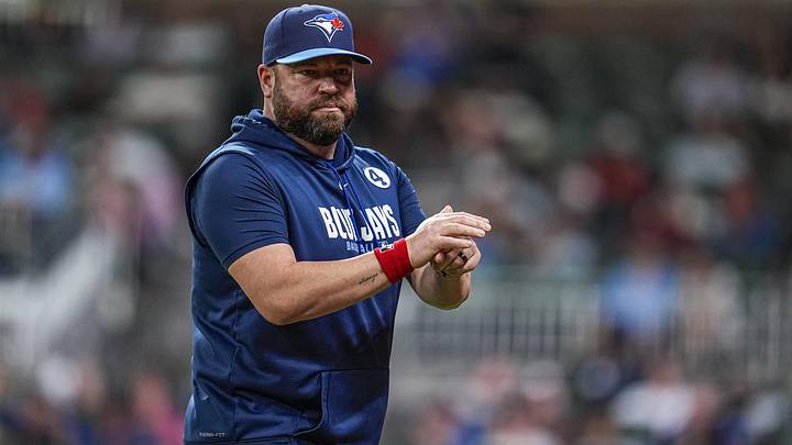Blue Jays manager John Schneider (14) on the field against the Atlanta Braves during the eighth inning at Truist Park. Blue Jays manager John Schneider (14) on the field against the Atlanta Braves during the eighth inning at Truist Park.