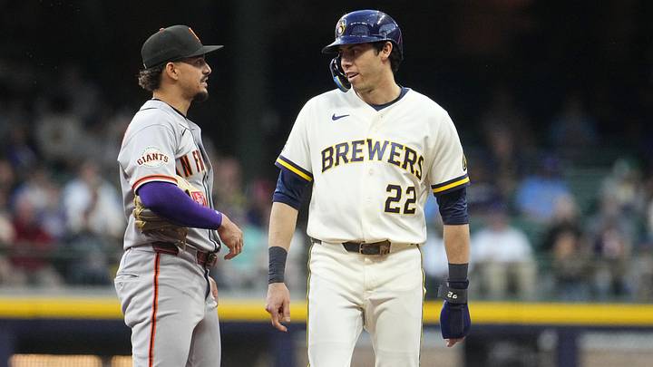 Jun 1, 2026; Milwaukee, Wisconsin, USA; Former teammates San Francisco Giants shortstop Willy Adames (2) and Milwaukee Brewers designated hitter Christian Yelich (22) at second base in the fourth inning at American Family Field. Mandatory Credit: Michael McLoone-Imagn Images