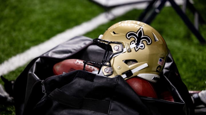 Nov 5, 2023; New Orleans, Louisiana, USA; Detailed view of the New Orleans Saints helmet and ball bag against the Chicago Bears during the first half at the Caesars Superdome. Mandatory Credit: Stephen Lew-Imagn Images Nov 5, 2023; New Orleans, Louisiana, USA; Detailed view of the New Orleans Saints helmet and ball bag against the Chicago Bears during the first half at the Caesars Superdome. Mandatory Credit: Stephen Lew-Imagn Images