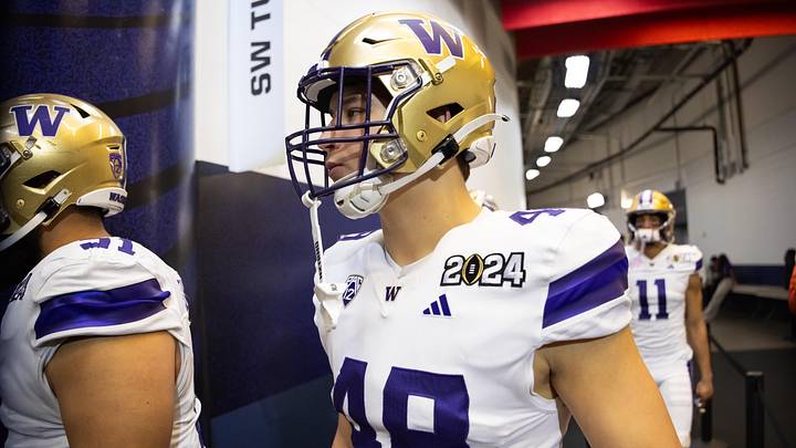 Husky edge rusher Jacob Lane heads to the field for the 2024 national championship game in Houston. 