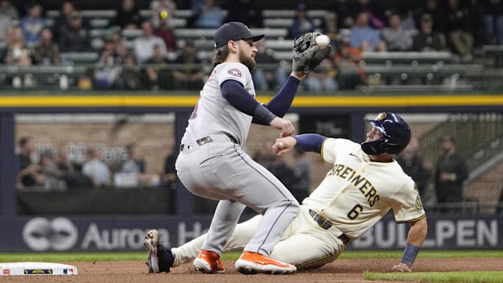 May 6, 2025; Milwaukee, Wisconsin, USA; Milwaukee Brewers outfielder Isaac Collins (6) steals second base ahead of the tag by Houston Astros second base Brendan Rodgers (1) in the sixth inning at American Family Field. Mandatory Credit: Michael McLoone-Imagn Images