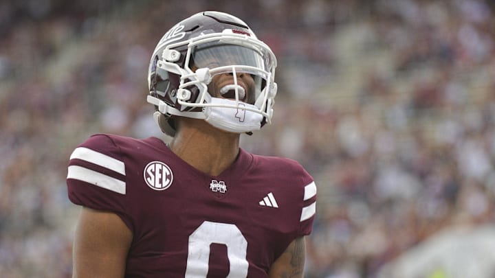Nov 2, 2024; Starkville, Mississippi, USA;  Mississippi State Bulldogs quarterback Michael Van Buren Jr. (0) reacts after a touchdown against the Massachusetts Minutemen during the second quarter at Davis Wade Stadium at Scott Field. Mandatory Credit: Matt Bush-Imagn Images