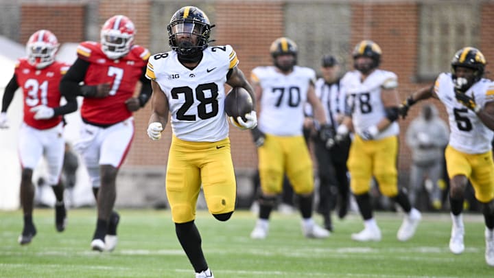 Nov 23, 2024; College Park, Maryland, USA;  Iowa Hawkeyes running back Kamari Moulton (28) runs for a touchdown during the second  half against the Maryland Terrapins at SECU Stadium. Mandatory Credit: Tommy Gilligan-Imagn Images
