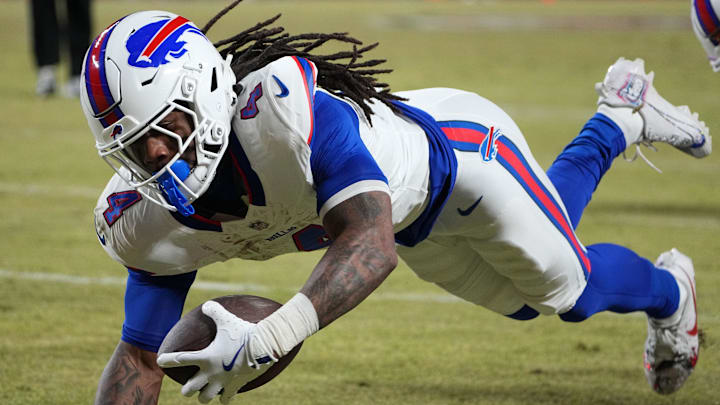 Jan 26, 2025; Kansas City, MO, USA; Buffalo Bills running back James Cook (4) dives for a touchdown against the Kansas City Chiefs in the AFC Championship game at GEHA Field at Arrowhead Stadium. Mandatory Credit: Denny Medley-Imagn Images