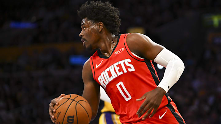 Apr 11, 2025; Los Angeles, California, USA; Houston Rockets guard Aaron Holiday (0) moves the ball against the Los Angeles Lakers during the first half at Crypto.com Arena. Mandatory Credit: Jonathan Hui-Imagn Images