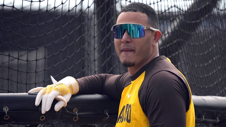 Feb 15, 2026; Peoria, AZ, USA; San Diego Padres third baseman Manny MacHado (13) gets ready to hit during spring training camp. Mandatory Credit: Rick Scuteri-Imagn Images