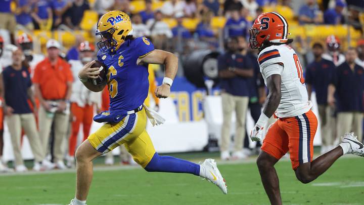 Sep 17, 2026; Pittsburgh, Pennsylvania, USA; Pittsburgh Panthers quarterback Mason Heintschel (6) runs the ball -a- Syracuse Orange defensive back Duce Chestnut (0) during the second quarter at Acrisure Stadium. Mandatory Credit: Charles LeClaire-Imagn Images Sep 17, 2026; Pittsburgh, Pennsylvania, USA; Pittsburgh Panthers quarterback Mason Heintschel (6) runs the ball -a- Syracuse Orange defensive back Duce Chestnut (0) during the second quarter at Acrisure Stadium. Mandatory Credit: Charles LeClaire-Imagn Images